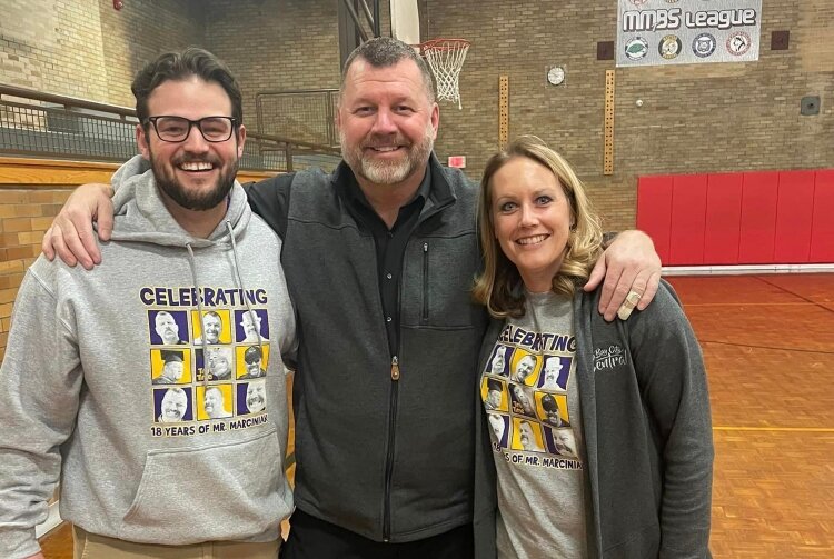 Tim Marciniak, center, retires from Bay City Central at the end of this school year. He'll be back next year, though, as the parent of a high school freshman.