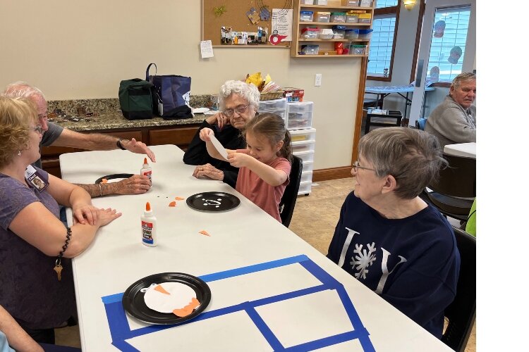 Crafts are the first item on the agenda when pre-schoolers from the Montessori Children's House of Bay City visit the residents of New Hope Bay  Assisted Living and Memory Care Community.