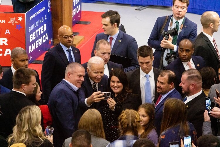 President Joe Biden captures a selfie of Todd Clements, from the Bay Area Chamber of Commerce Board of Directors, and Magen Samyn, Bay Area Chamber of Commerce President. 