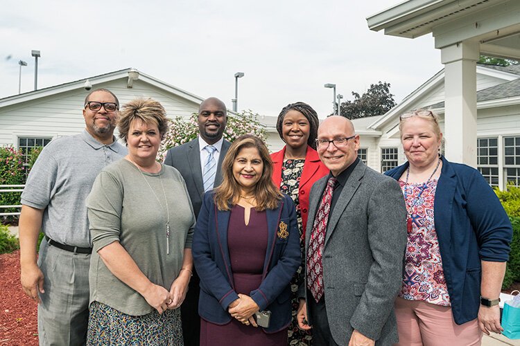 Steven Elam, Ginelle Skinner, Gregory Anglin, Mumtaz Haque, Alena Zachery-Ross, Carlos Lopez, and Nina Harris at YCS Administration Building.