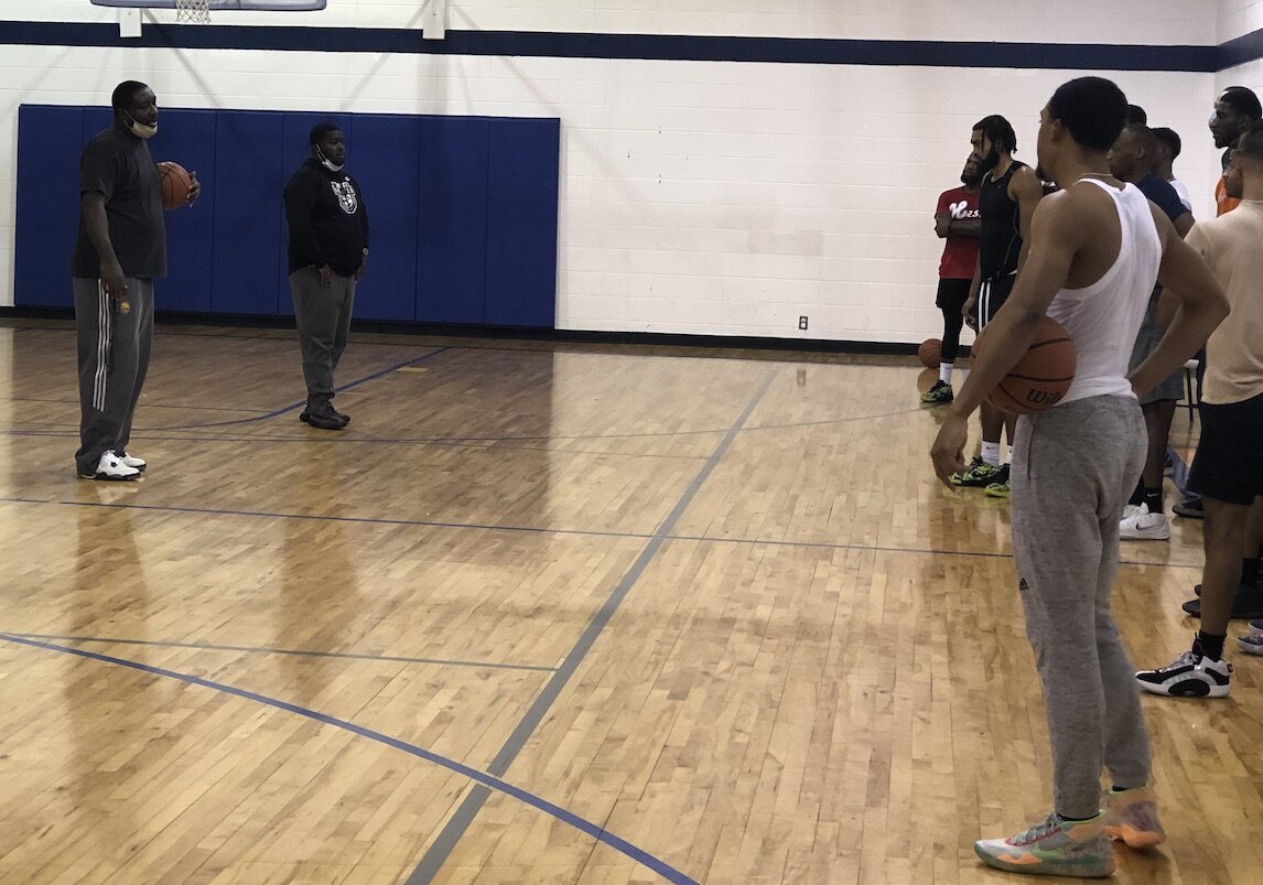 Former Flint Northwestern and Michigan State star Kelvin Torbert talks with athletes during a Flint United tryout on January 17.