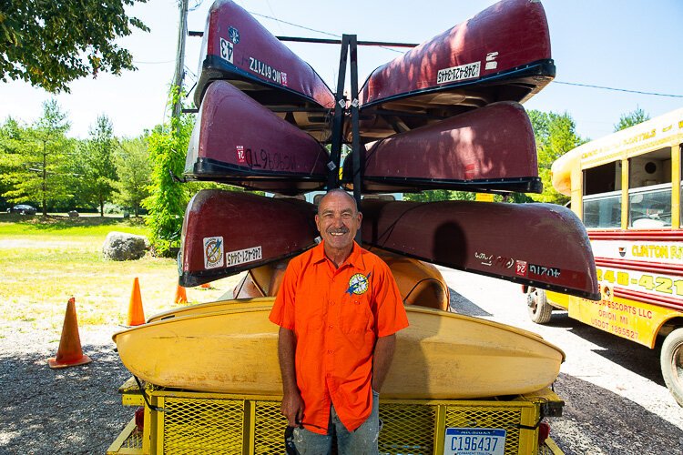 Jerry Reis stands in front of several of his company's watercraft.