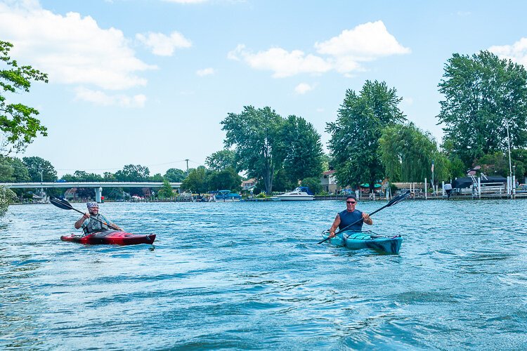 David Sands and Hans Dengler kayak on the Clinton River.