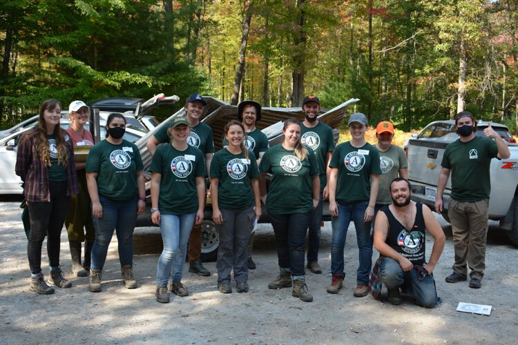 Local partners and members of the Huron Pines AmeriCorps worked on cleaning up debris and rebuilding the bridge at Forestview Natural Preserve, which was damaged in May 2020 during the flooding.  Photo credit Chris Engle.