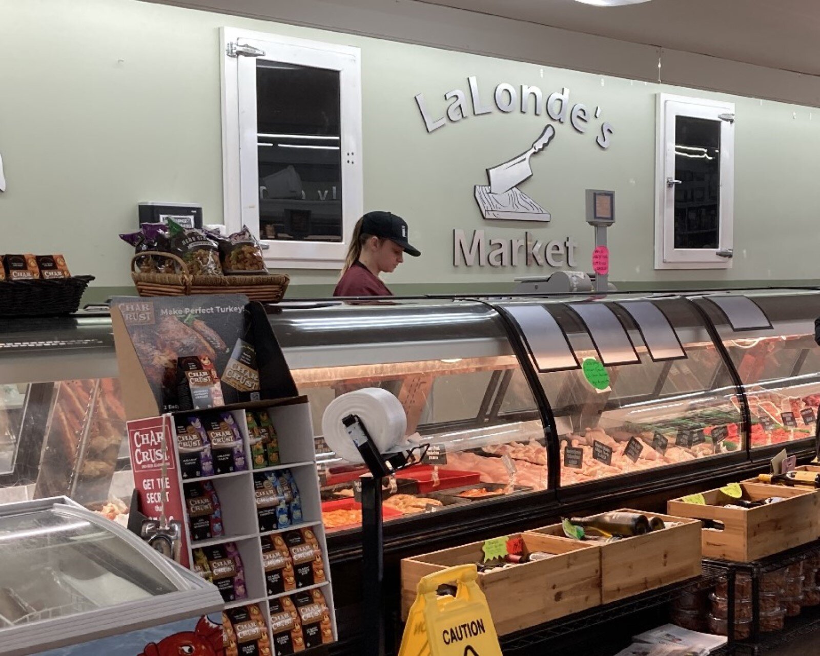 Serving a customer at LaLonde's Market in Midland.
