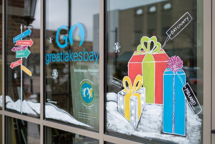 Presents and tourism signage welcome all at Go Great Lakes Bay Region’s office.