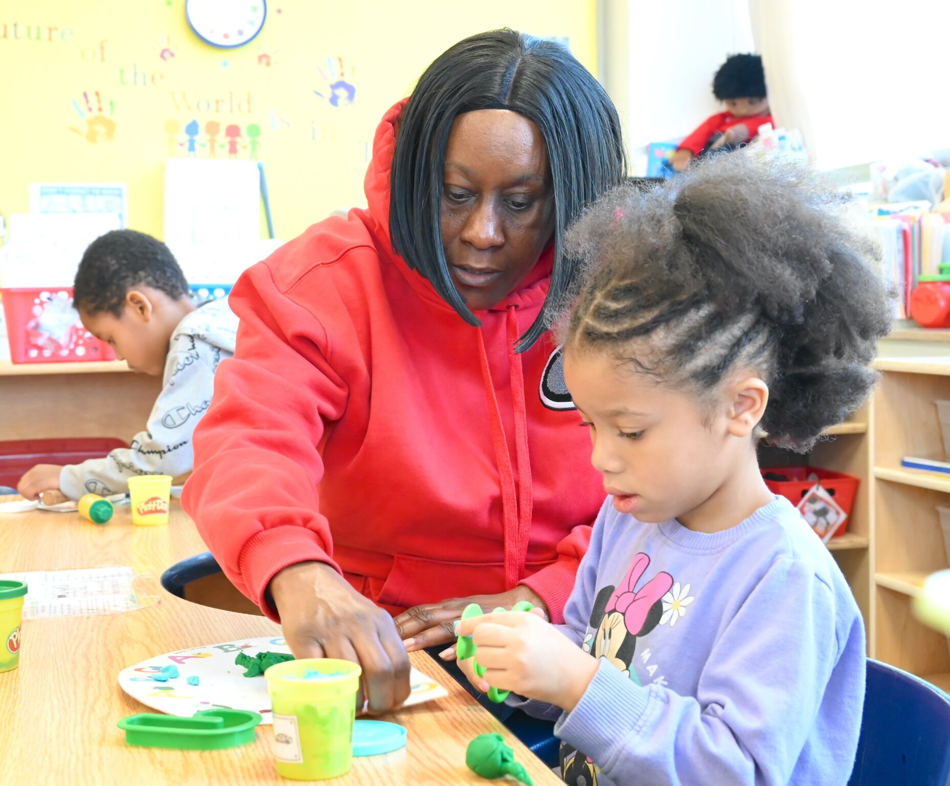 Katherine Johnson works with a young child at New Harvest Christian’s Learning Center.