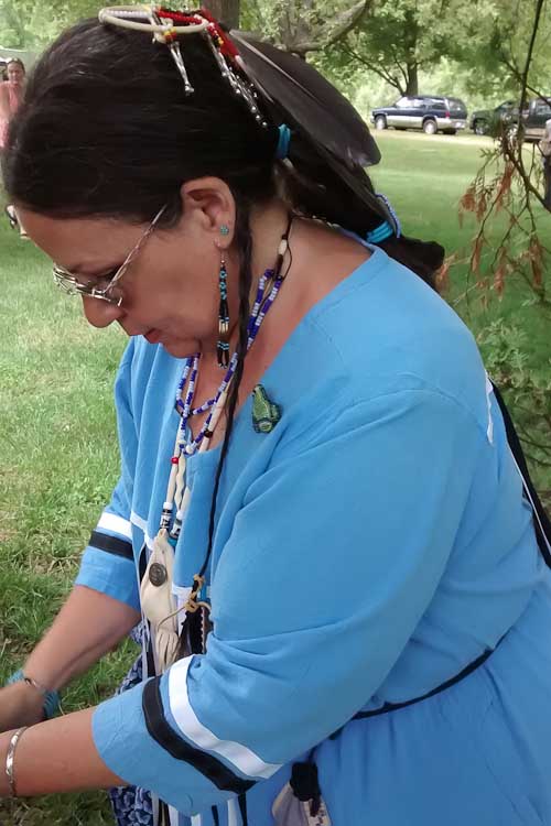 Jacqui Faust prepares to dance at a Pow Wow.
