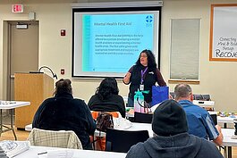 Adrienne Luckenbacher, Mental Hhealth First Aid Trainer at St. Clair County Community Mental Health leads the training with a group of Blue Water Developmental Housing employees. 