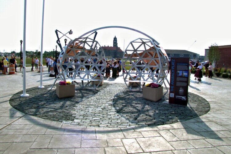 A sculpture, made up of a split globe connected by a large metal arch, symbolizes the relationship between Bay City and its sister city Ansbach, Germany. The sculpture in Uptown Bay City was dedicated in 2022.