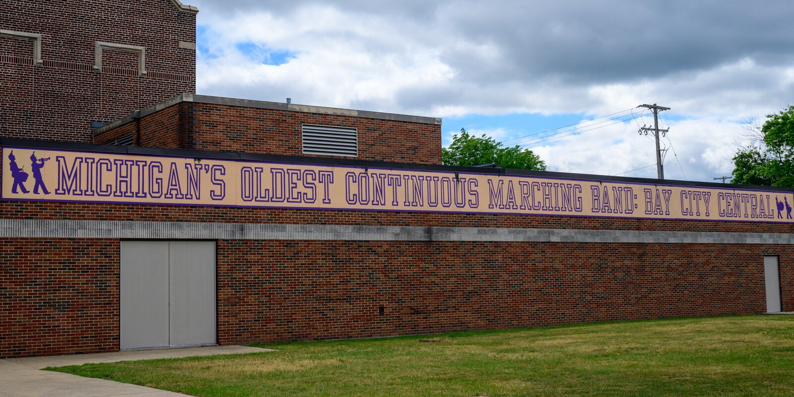 The sound of marching band music rings out from Bay City Central High