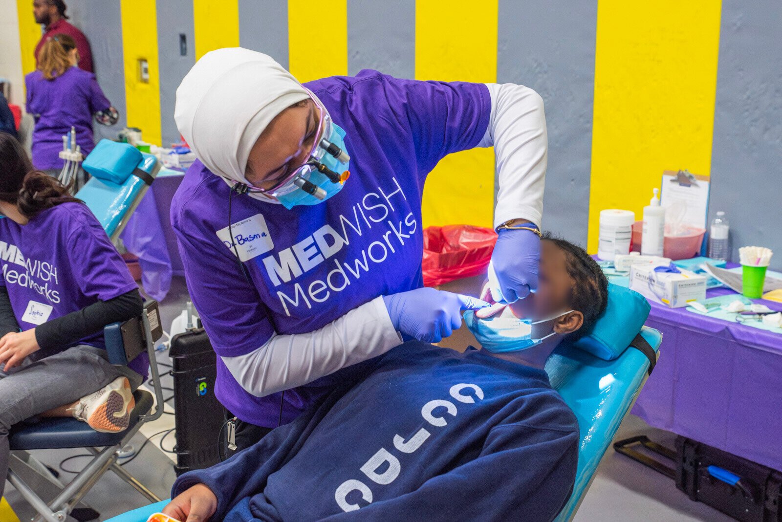 A MedWish MedWorks volunteer doctor works on a patient at the Cuyahoga County Juvenile Detention Center.