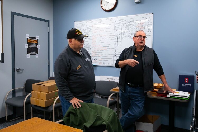 Jim Reha, at left, and Keith Markstrom, at right, explain how the Veterans Workshop and Learning Center is trying to meet the needs of veterans.