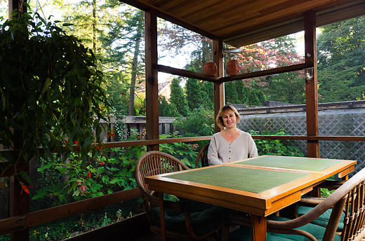 Michele Swanson on the porch of her Burns Park home