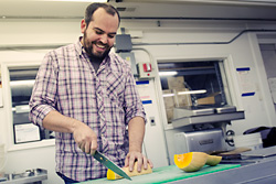 Brad Greenhill in the kitchen he shares with Jerusalem Garden