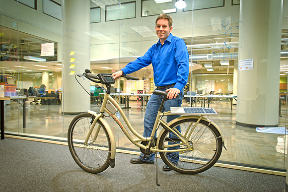 Ansgar Strother with an A2B Bikeshare bicycle at the TechArb