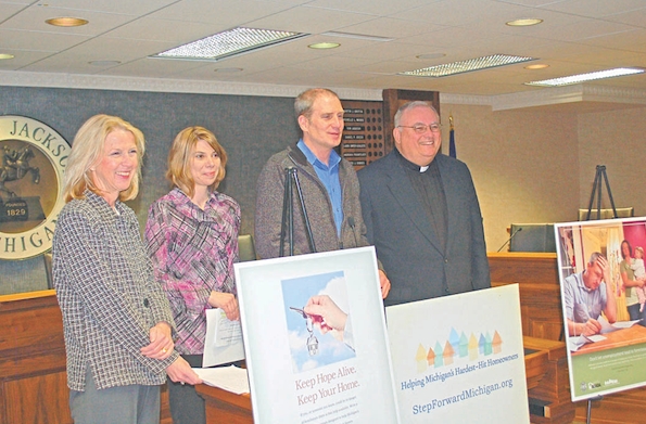 State housing administrators joined Jackson-area local officials and faith leaders during an April 8 press conference at Jackson City Hall to promote the Step Forward Michigan Faith Partnership, which offers free help to prevent foreclosure. Pictured