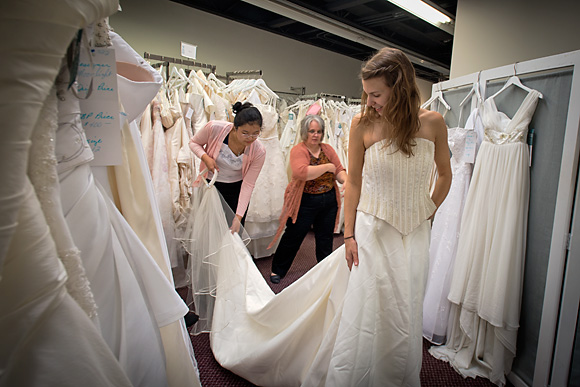 Kristen Oltersdorf trying on a dress at The Brides Project Boutique