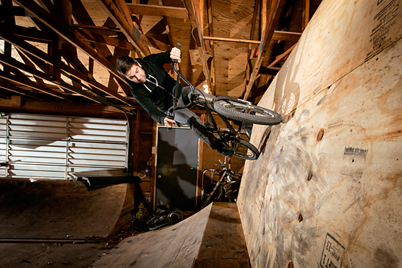 Thomas Hosford riding an Ordnance BMX Bike at an indoor BMX half pipe