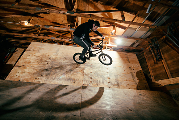 Thomas Hosford riding an Ordnance BMX Bike at an indoor BMX half pipe