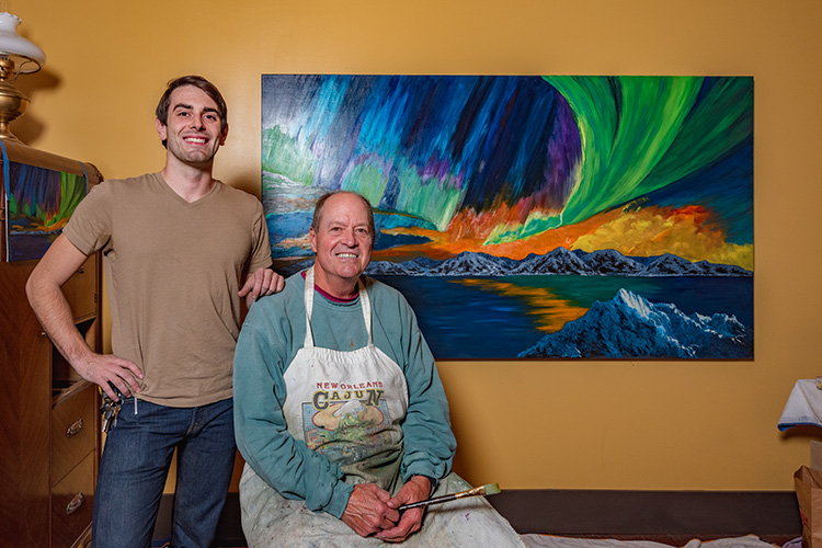 Patton Doyle with his uncle J Robert Doyle and one of his paintings at Decode Ypsilanti