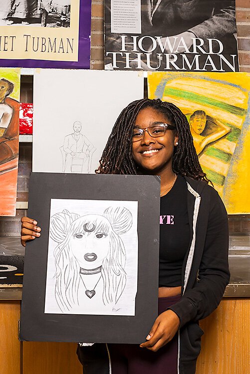 YCS student Kiayre Cook with her art work.