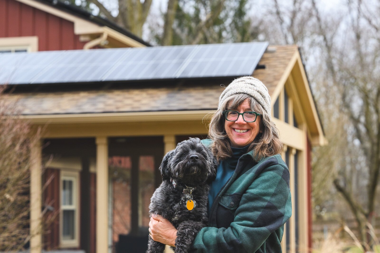Julie Roth outside her solar panel equipped home.