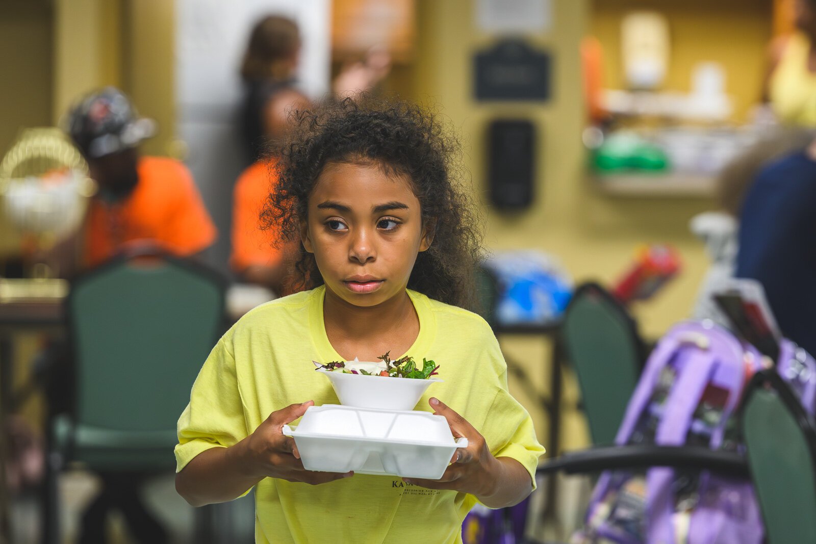 Aleya Cullins serving meals at Chidester Place.