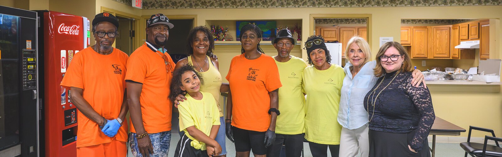 Emy Deshotel (right) with volunteers providing meals and bingo at Chidester Place.