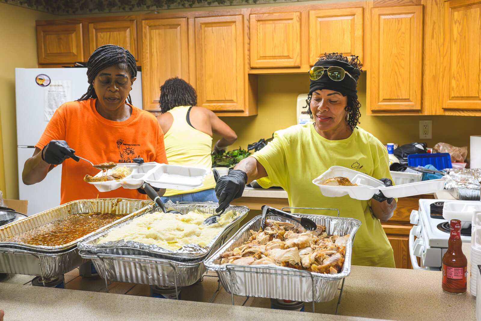 Sonya Townshend and Bonnie Lawrence serving meals at Chidester Place.