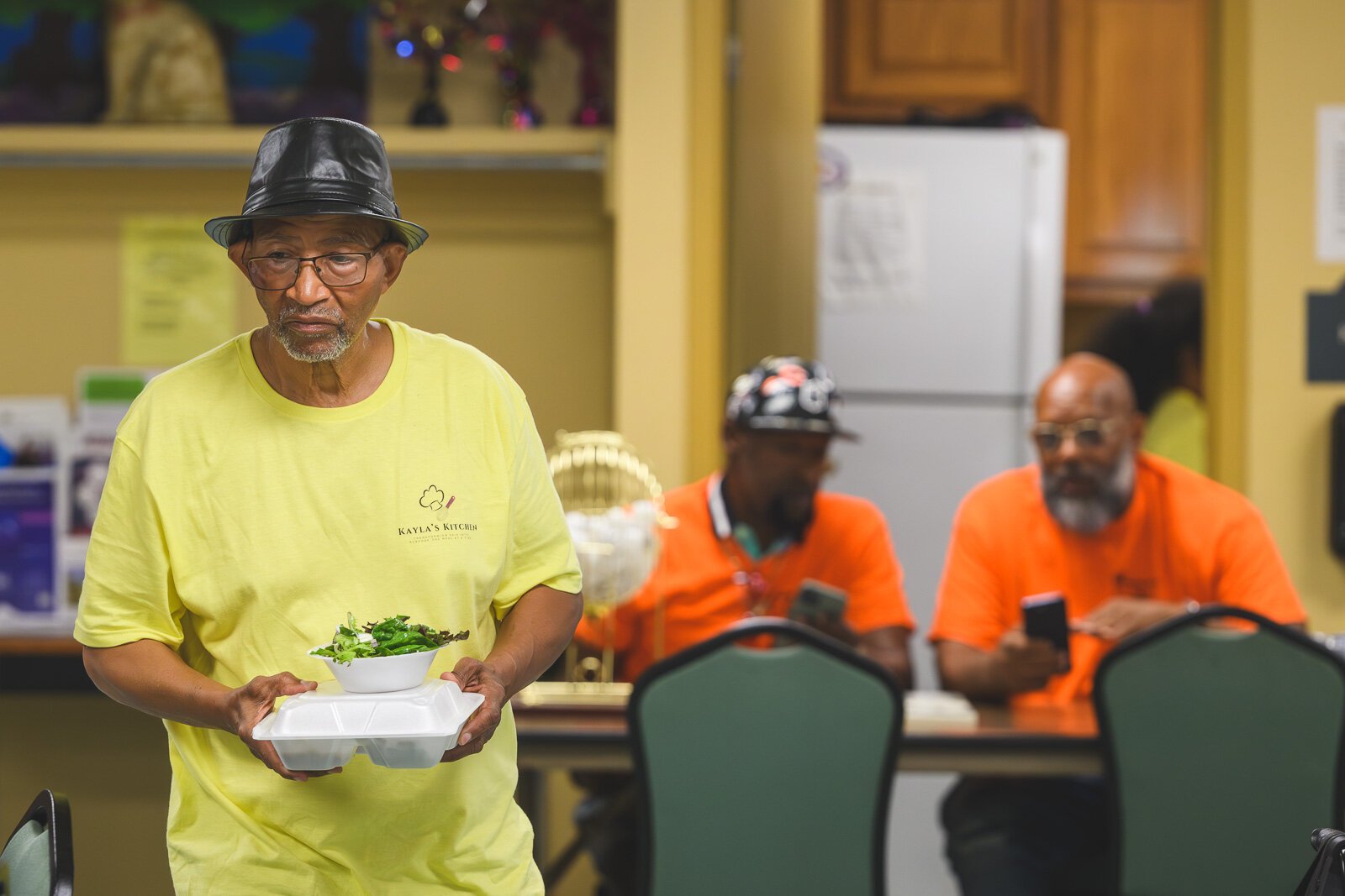 Jimerele Hawkins serving meals at Chidester Place.