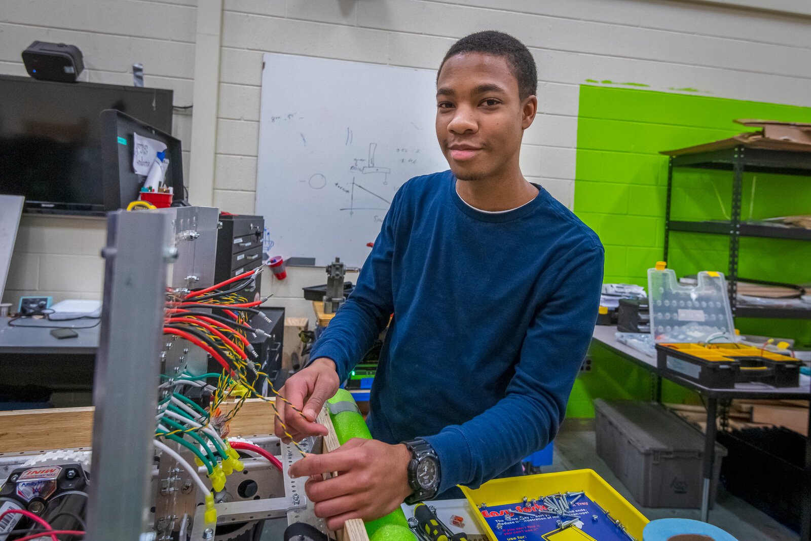 Austin McDonald works on a robot with Lincoln High School's Linc-Bots team in 2019.