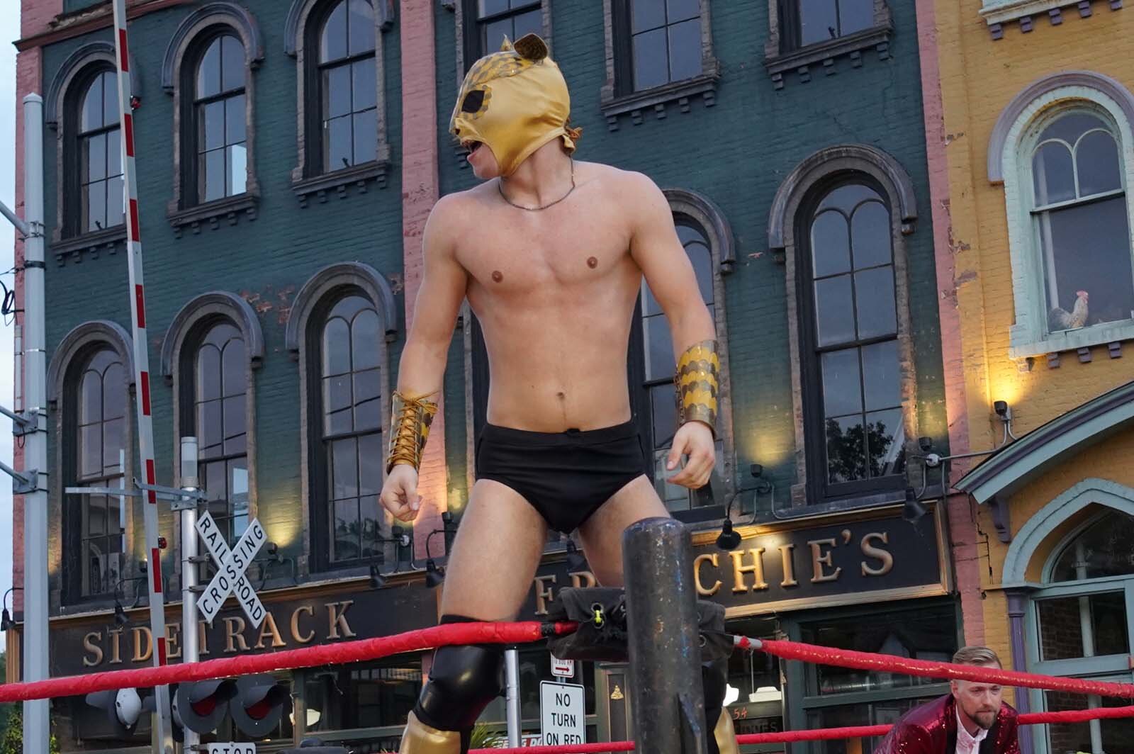 A professional wrestler performs as "Bruce Buzzbee" at the first Rumble of the Bumble in 2022.