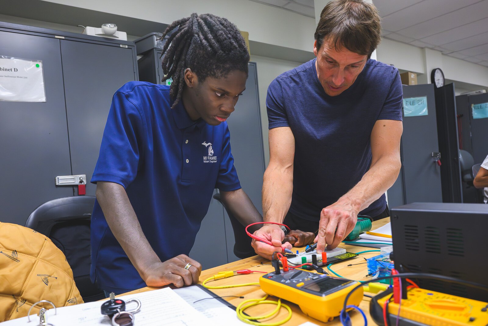 FAME program student Darrius Johnson (left) and Mike Ozerdier in Basic Electronics class at WCC.