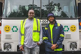 Courtney Franklin and Greg Carter demonstrating a recycling truck at the Ann Arbor's Material Recycling Facility tour.