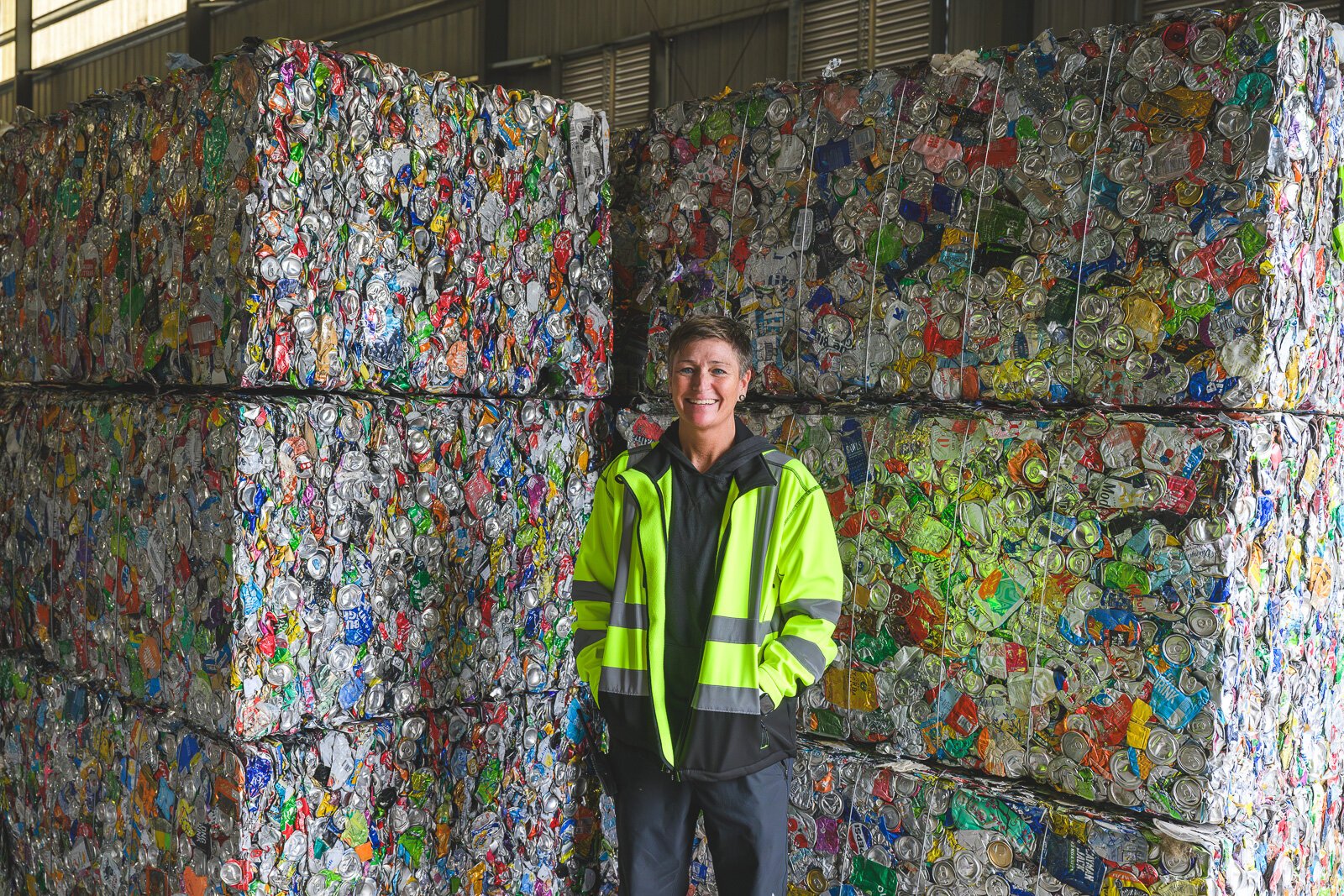 Michelle Moravcik with recycled can bales at Ann Arbor's Material Recycling Facility.