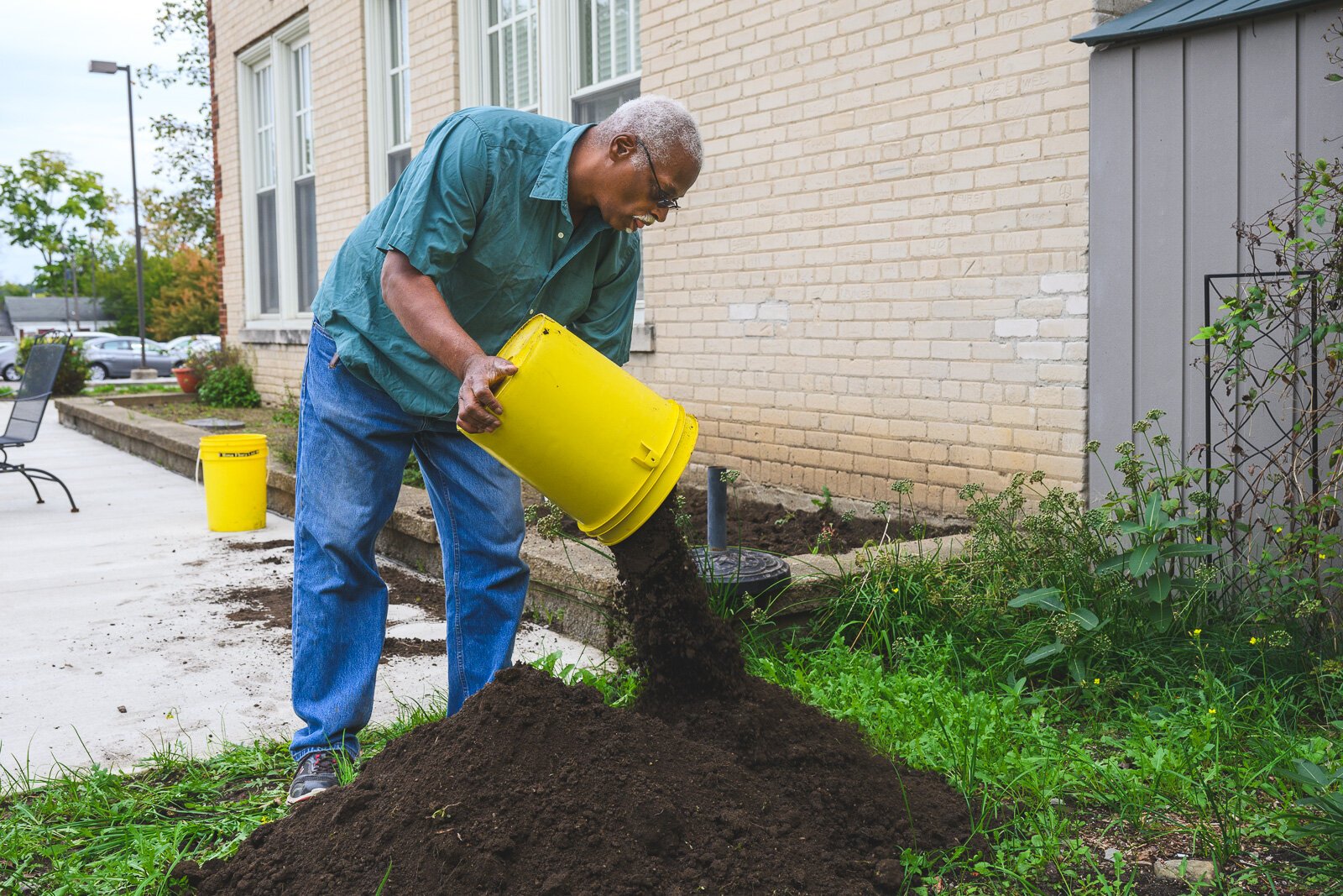 Roger Smith working on the gardens at Cross Street Village.