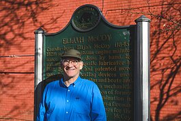 Dave Strenski in front of the Elijah McCoy plaque in Library Park.