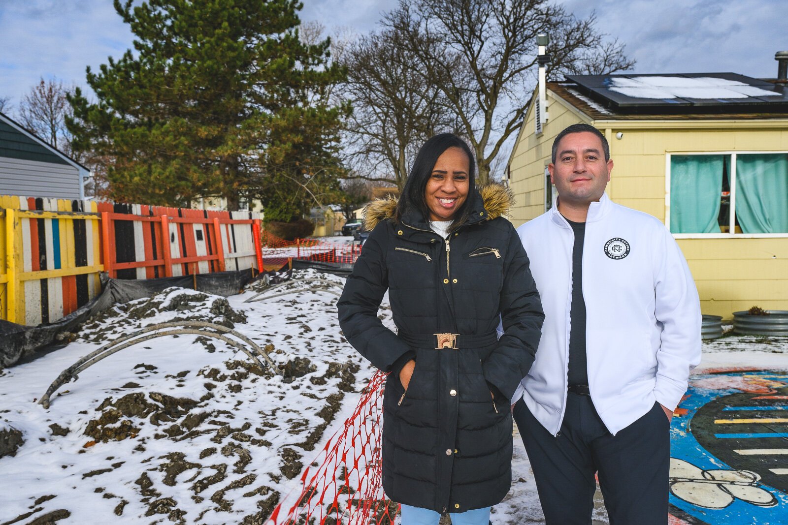 Krystal Steward and Derrick Miller by the excavation for Bryant Community Center's geothermal installation.