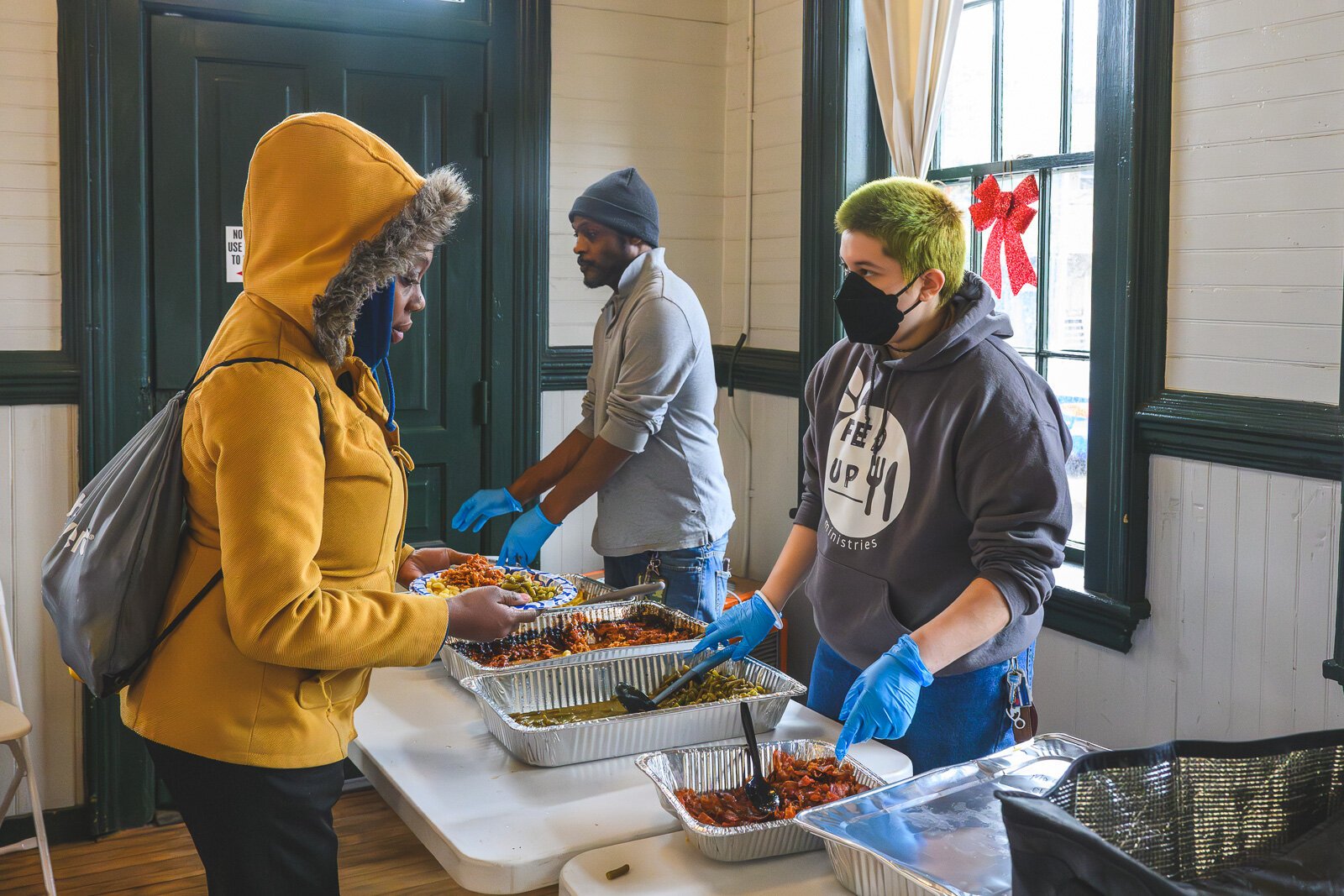 Saprina Morris getting lunch from FedUp Ministries at the Ypsilanti Freighthouse daytime warming center.