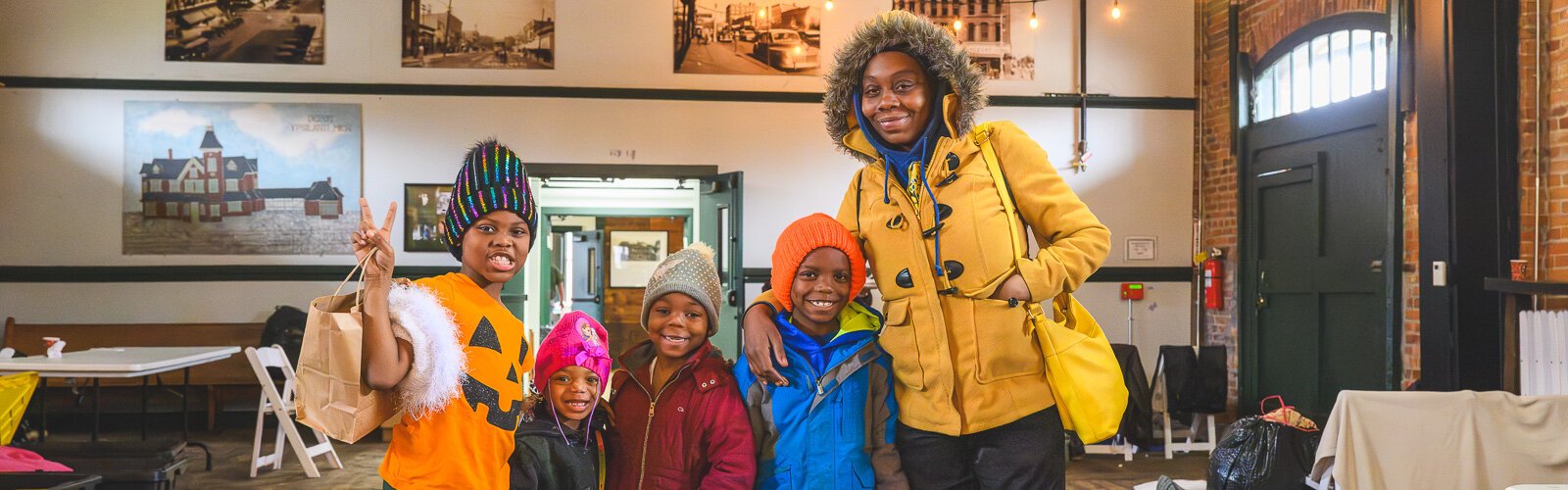 Saprina Morris (right) with her children Lizzianna, Deanna, Dontae, and Destiny at the Ypsilanti Freighthouse daytime warming center.