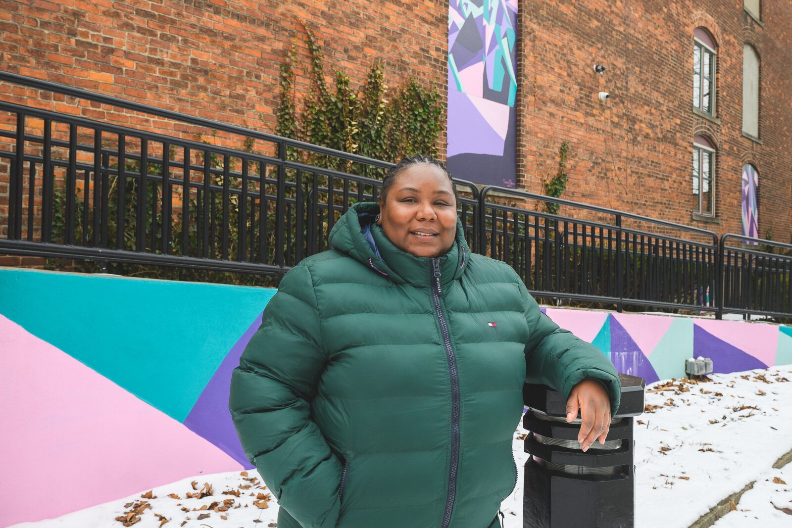 T'onna Clemons with her mural at RAC.