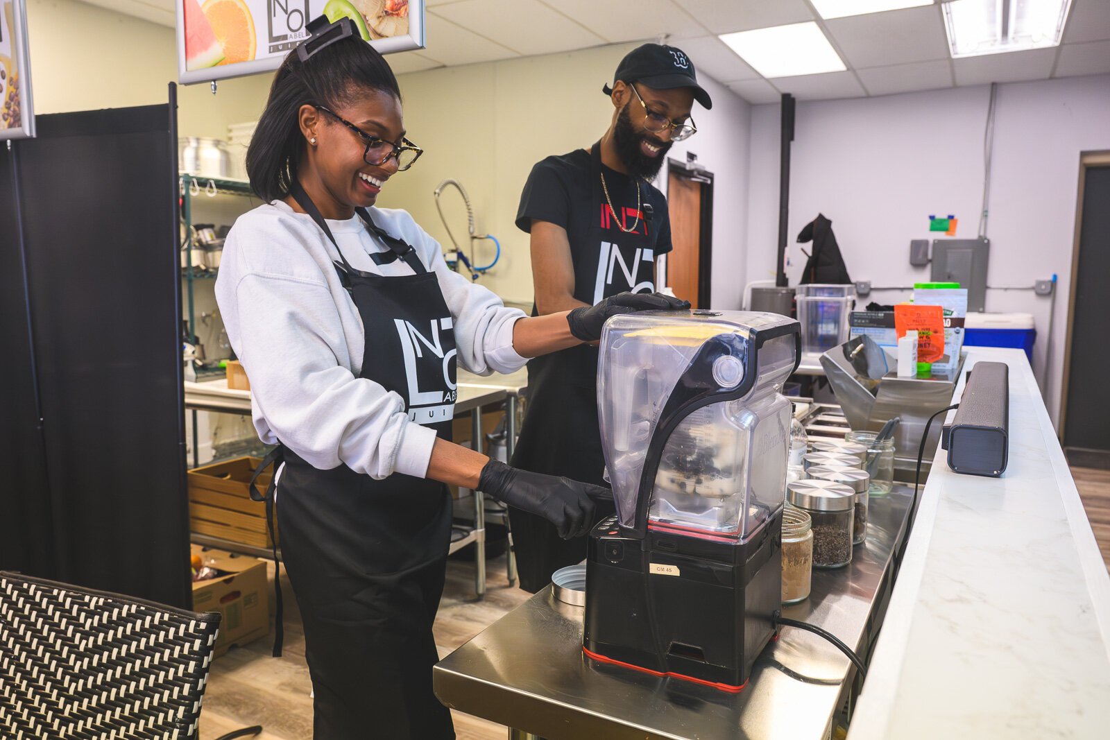 Nashia and Brandon Frye preparing smoothies at No Label Juice.