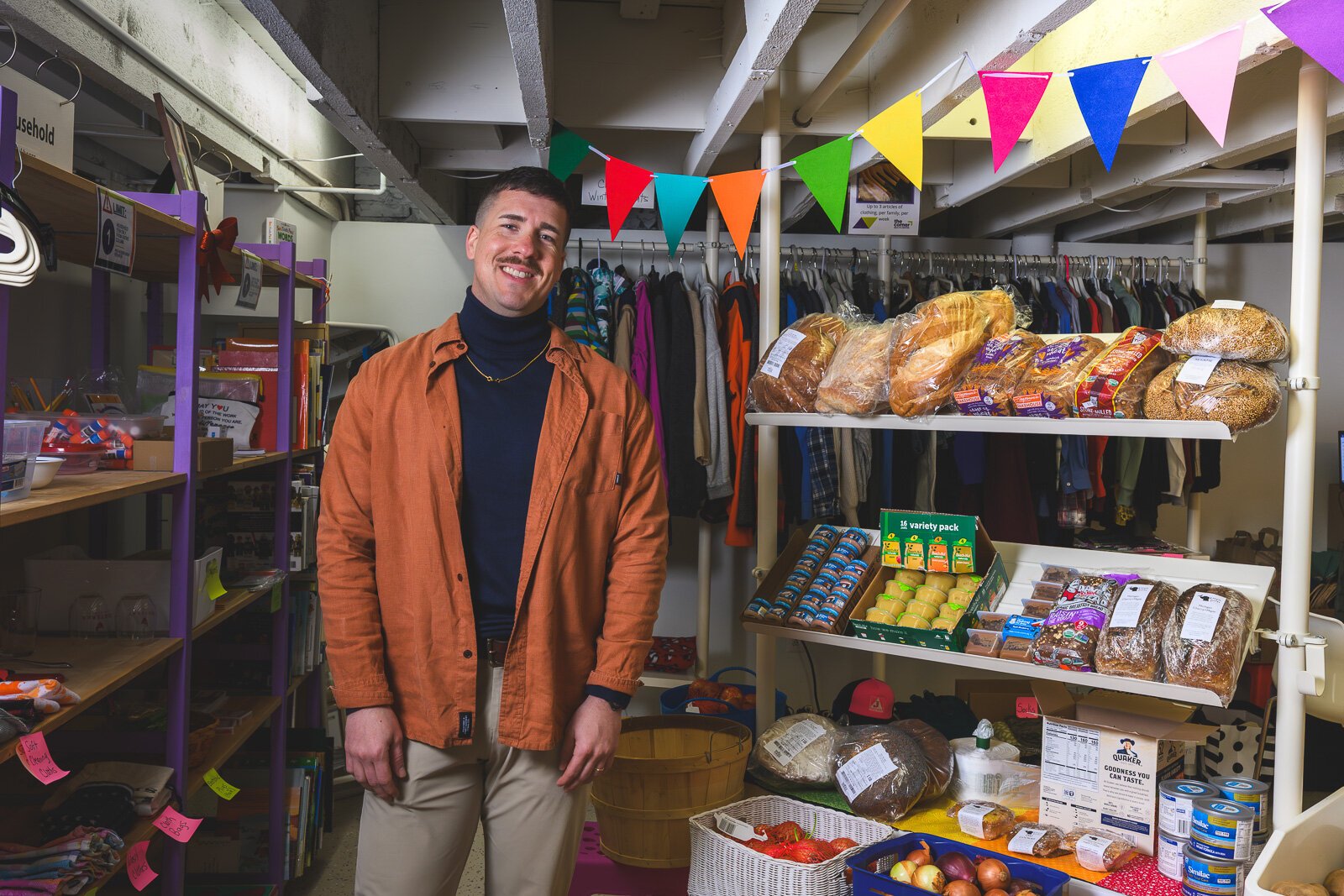 Executive Director Alex Plum at Corner Health Center's clothing closet and food pantry.