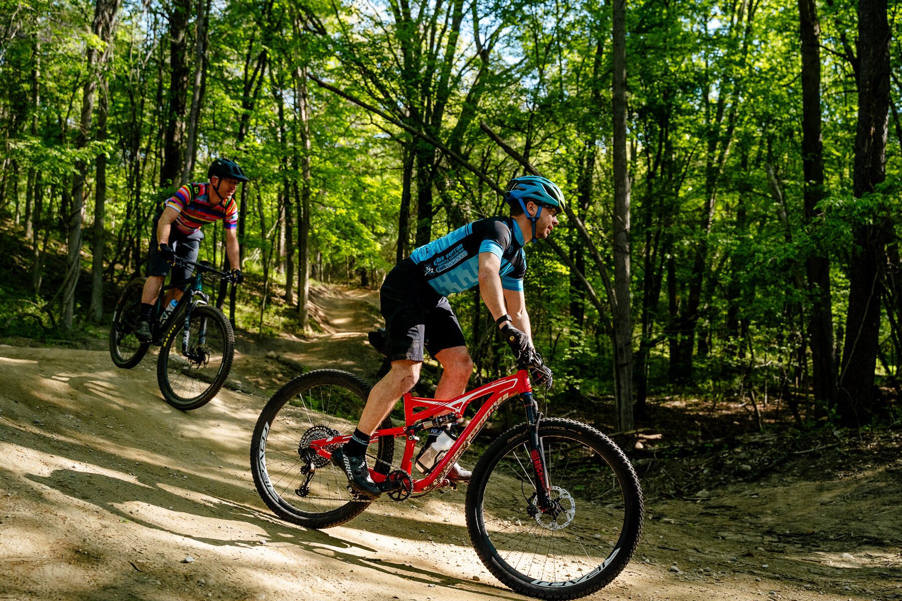 From left, Steve Vigneau and Adam Pokowski ride the Shelden Trails at Stony Creek Metropark.