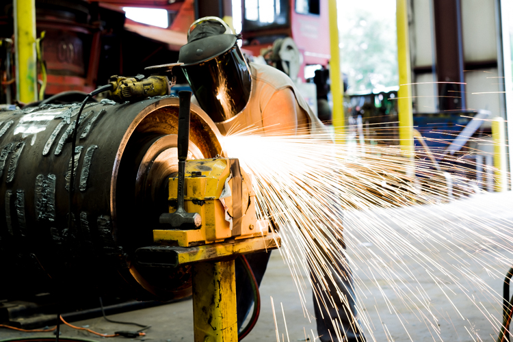 An employee at work at Bandit Industries outside Remus, Michigan