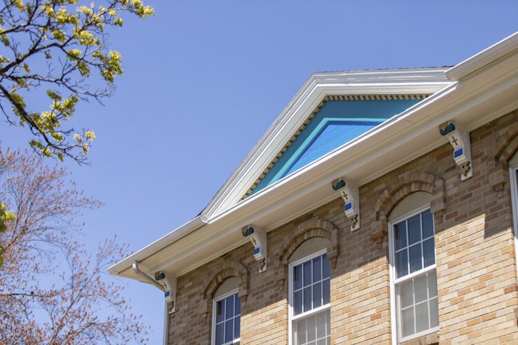 An overview of roofing at 503 East Broadway boasts blue and gold details.