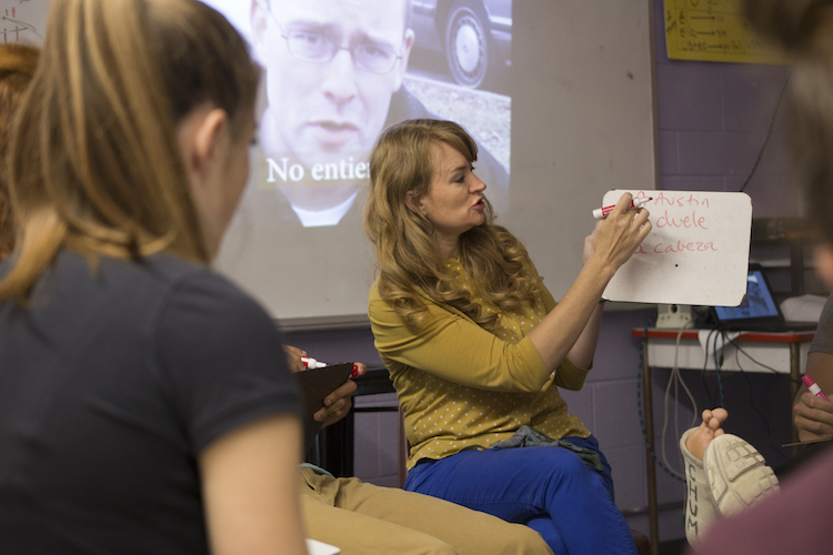 Spanish teacher April Dice uses a dry erase board to demonstrate a point during class on Monday, Oct. 8, 2018 at Sacred Heart Academy.