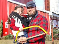 Customers Matthew and Rosie Bednorek come to Swan's Christmas Tree Farm every year to pick out their tree.