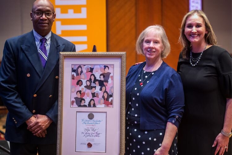 Dr. Vincent Mumford (left) and Annie Sanders (right) stand with this year’s “Mumford Prize for Good” recipient, Kim West (center), on May 8, 2024.